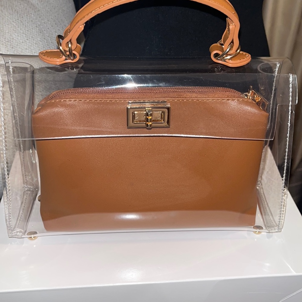 Clear purse comes with little brown bag inside Brand New
